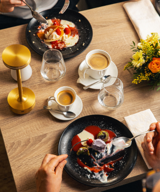 Dishes, coffee and flowers on an Orangerie table