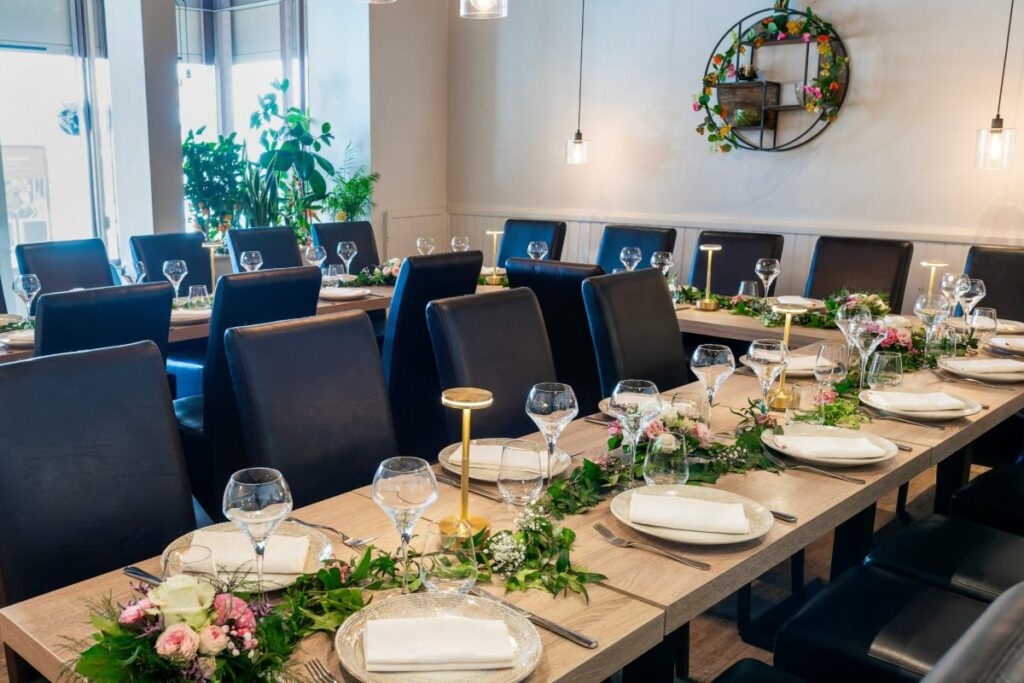 The Faubourg de Lyon salon set up for a group meal at L’Orangerie, Montargis